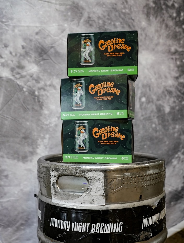 Gasoline Dreams six-pack cartons stacked on a keg